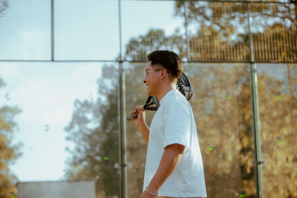 Sideview of a man holding pickleball paddle